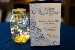 Picture of A Night at the Library 2026 invitation and centerpiece
